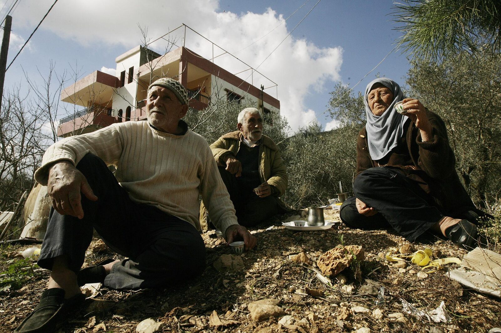 Elders sharing coffee outdoors